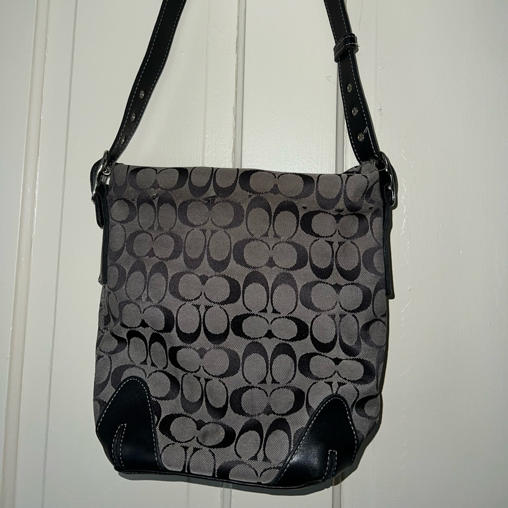 This Coach Signature hobo bag is the perfect accessory for any casual occasion.
